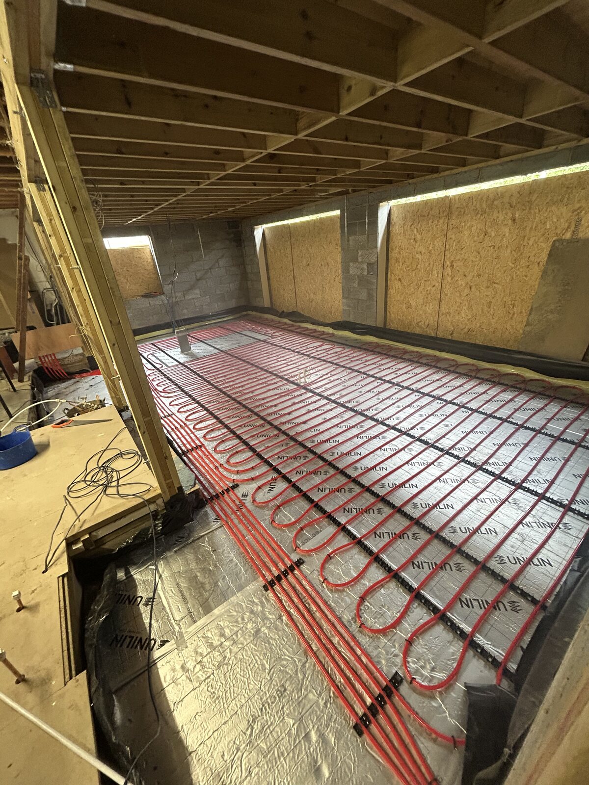 Completed wet underfloor heating pipework across the Wadhurst extension