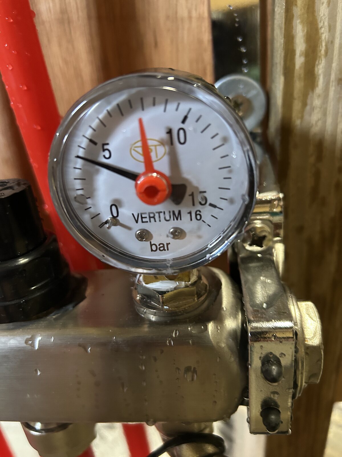 Pressure gauge testing the filled underfloor heating system